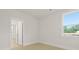Bright bedroom with large window offers a light-filled space and neutral design at 205 Bilge Rd, Ridgeville, SC 29472
