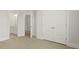 Bedroom with hardwood floors with a view to the bathroom and a double door closet at 205 Bilge Rd, Ridgeville, SC 29472