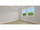 Bedroom with two windows that provide natural light and base molding at 205 Bilge Rd, Ridgeville, SC 29472