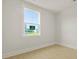 Clean bedroom featuring hardwood floors and a large window with natural light at 205 Bilge Rd, Ridgeville, SC 29472