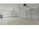 Spacious three car garage with high ceilings and automatic doors at 205 Bilge Rd, Ridgeville, SC 29472