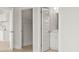 Hallway view to a powder room and a closet/pantry with modern doors at 205 Bilge Rd, Ridgeville, SC 29472