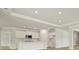 Modern kitchen with stainless steel appliances, white cabinets, and a large island at 205 Bilge Rd, Ridgeville, SC 29472