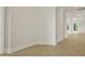 Open-concept living room with hardwood floors and bright white walls at 205 Bilge Rd, Ridgeville, SC 29472