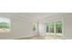 Living room features a sliding glass door and two large windows at 205 Bilge Rd, Ridgeville, SC 29472