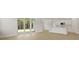 Living area with sliding glass doors leading to yard and view of the kitchen at 205 Bilge Rd, Ridgeville, SC 29472