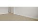 Living room with base molding and neutral colored walls and floors at 205 Bilge Rd, Ridgeville, SC 29472
