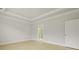 Main bedroom features a tray ceiling, light-colored hardwood floors, and an ensuite bathroom at 205 Bilge Rd, Ridgeville, SC 29472
