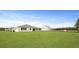 A spacious backyard of a home, complemented by a lush green lawn at 214 Bilge Rd, Ridgeville, SC 29472