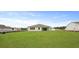 View of a house and backyard with a newly constructed home nearby at 214 Bilge Rd, Ridgeville, SC 29472