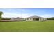 A spacious backyard featuring a covered patio and ample green space at 214 Bilge Rd, Ridgeville, SC 29472