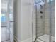 Modern bathroom with a glass-enclosed shower and sleek gray tile at 214 Bilge Rd, Ridgeville, SC 29472