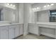 Bright bathroom featuring double vanities, large mirrors, and ample counter space at 214 Bilge Rd, Ridgeville, SC 29472