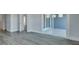 Bedroom with new wood floors, base trim package and access to a sliding glass door at 214 Bilge Rd, Ridgeville, SC 29472