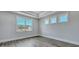 Well-lit bedroom with new floors and trim package features multiple windows for great views at 214 Bilge Rd, Ridgeville, SC 29472