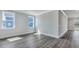 Sunlit bedroom features new wood floors, a modern trim package and multiple windows at 214 Bilge Rd, Ridgeville, SC 29472