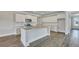 Modern kitchen featuring stainless steel appliances, quartz countertops, and a kitchen island at 214 Bilge Rd, Ridgeville, SC 29472