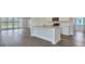 Kitchen featuring a quartz island, stainless steel appliances, and access to the backyard through sliding doors at 214 Bilge Rd, Ridgeville, SC 29472