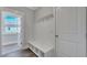 Mudroom featuring built-in bench, cubbies, coat hooks and a view into the exterior at 214 Bilge Rd, Ridgeville, SC 29472