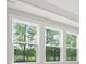 Bright windows offer views of the natural landscape with mature trees at 214 Bilge Rd, Ridgeville, SC 29472