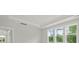 Bright open room with views of lush landscaping through the windows at 214 Bilge Rd, Ridgeville, SC 29472