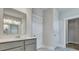 Well-lit bathroom with modern vanity, mirror, and white doors to closet and toilet at 215 Bilge Rd, Ridgeville, SC 29472