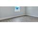 Empty bedroom with modern flooring and a bright window at 215 Bilge Rd, Ridgeville, SC 29472
