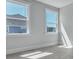 Bright bedroom with ample natural light from two large windows at 215 Bilge Rd, Ridgeville, SC 29472