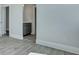 Hallway featuring grey vinyl floors that transition to marble tile and grey walls at 215 Bilge Rd, Ridgeville, SC 29472