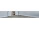 View of a hallway featuring a door to a bathroom with tile floor and gray walls at 215 Bilge Rd, Ridgeville, SC 29472