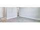 Open hallway with grey vinyl flooring and doors leading to various rooms at 215 Bilge Rd, Ridgeville, SC 29472