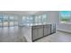 Open-concept kitchen with a center island, stainless steel dishwasher, and view of the backyard at 215 Bilge Rd, Ridgeville, SC 29472