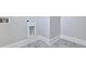 Close-up view of the laundry room featuring tile floors and washer/dryer hookups at 215 Bilge Rd, Ridgeville, SC 29472