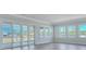 Bright living room featuring sliding glass doors, large windows, and views of the outdoors at 215 Bilge Rd, Ridgeville, SC 29472