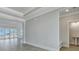 Open-concept living room with stylish floors, decorative ceiling and view of a half bath at 215 Bilge Rd, Ridgeville, SC 29472