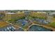 Aerial view of a building complex with extensive parking, landscaping, and a scenic pond at 225 Seven Farms Dr # 307, Daniel Island, SC 29492