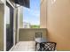 Cozy balcony with wrought iron furniture, offering a relaxing outdoor space with neighborhood views at 225 Seven Farms Dr # 307, Daniel Island, SC 29492