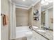Well-lit bathroom with a shower-tub, granite counters, and neutral walls, perfect for relaxing at 225 Seven Farms Dr # 307, Daniel Island, SC 29492