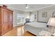 Light filled bedroom with large wardrobe, window, light walls, and hardwood floors at 225 Seven Farms Dr # 307, Daniel Island, SC 29492