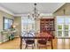 Dining room featuring hardwood floors, a chandelier, shuttered windows, and elegant furnishings at 225 Seven Farms Dr # 307, Daniel Island, SC 29492