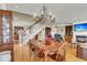 Open-concept dining area with chandelier next to staircase and living room at 225 Seven Farms Dr # 307, Daniel Island, SC 29492