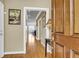 Inviting entryway featuring a hardwood floor, art, and a charming glimpse into the interior at 225 Seven Farms Dr # 307, Daniel Island, SC 29492