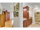 Hallway featuring cabinets and leading into living area and full bath at 225 Seven Farms Dr # 307, Daniel Island, SC 29492