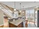 Kitchen island boasts granite countertops, stainless steel appliances, and pendant lighting at 225 Seven Farms Dr # 307, Daniel Island, SC 29492