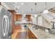 Kitchen with stainless steel appliances, wood cabinets, and granite countertops at 225 Seven Farms Dr # 307, Daniel Island, SC 29492