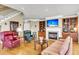 Bright living room with fireplace, built-in shelves, and staircase at 225 Seven Farms Dr # 307, Daniel Island, SC 29492
