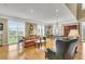 Spacious living room featuring hardwood floors, plantation shutters, and elegant decor at 225 Seven Farms Dr # 307, Daniel Island, SC 29492