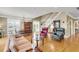 Open-concept living room featuring hardwood floors, natural light, and a staircase at 225 Seven Farms Dr # 307, Daniel Island, SC 29492