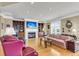 Bright living room with hardwood floors, a fireplace, built-in cabinets, and stylish furnishings at 225 Seven Farms Dr # 307, Daniel Island, SC 29492