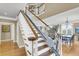 Staircase with a chair lift offering accessibility and convenience at 225 Seven Farms Dr # 307, Daniel Island, SC 29492